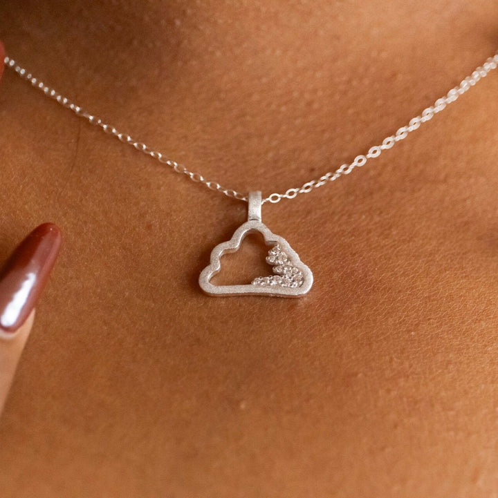 model wears Sparkly Silver Cloud Charm Pendant Necklace -  Claire Hill Designs