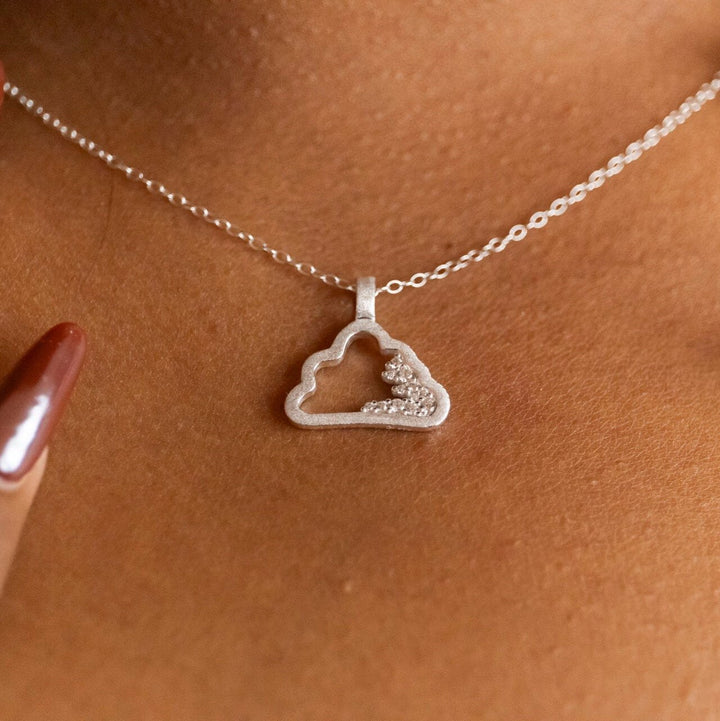 model wears Sparkly Silver Cloud Charm Pendant necklace -  Claire Hill Designs