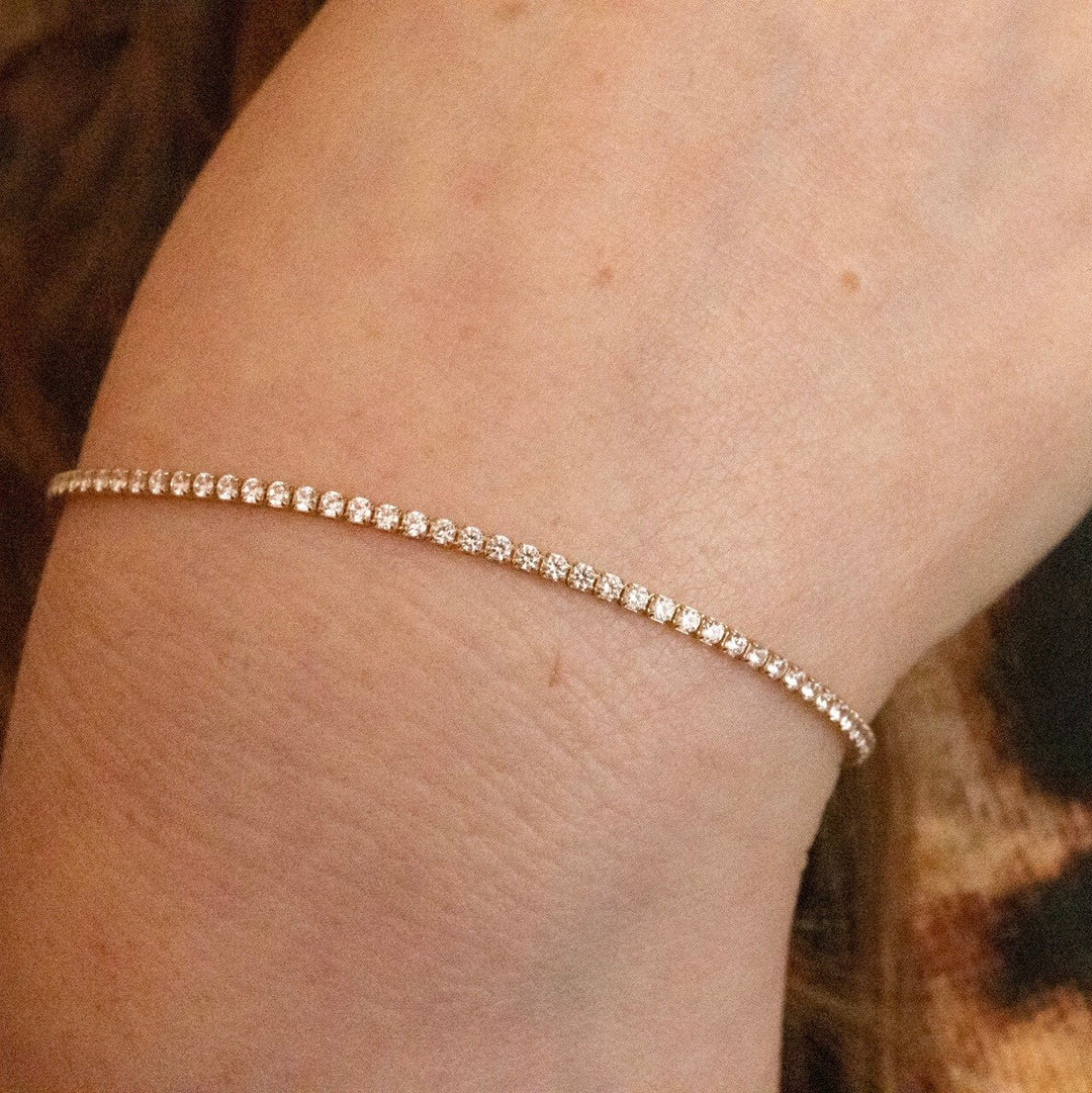 model wears 18k gold vermeil sparkly cubic zirconia tennis bracelet
