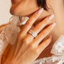 Model wears sparkly silver eternity ring and silver lab grown diamond ring