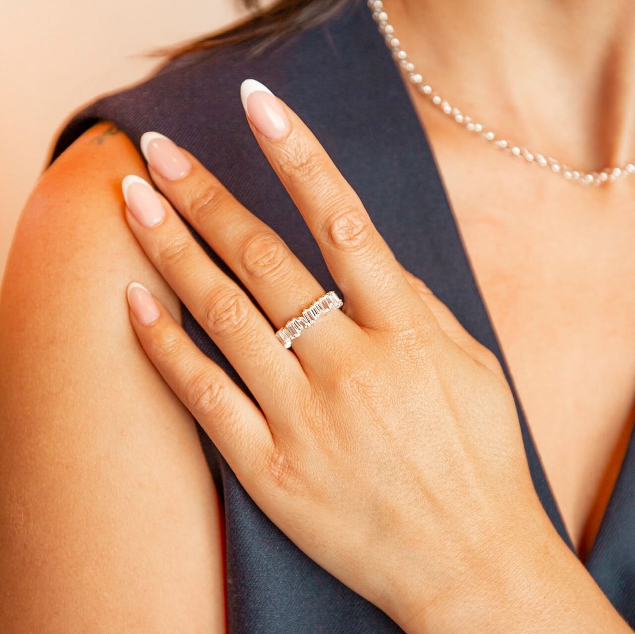 model wears silver sparkly cz eternity ring 