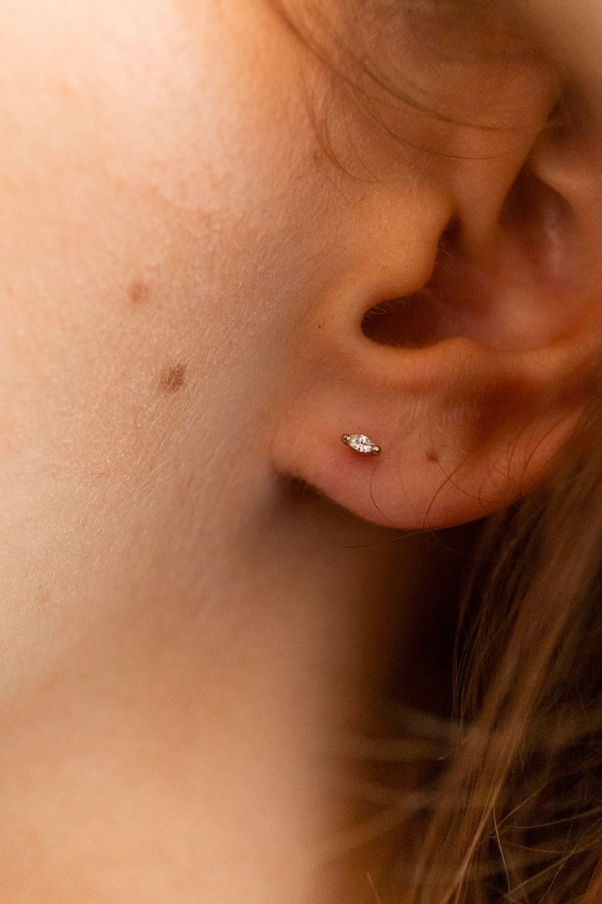 model wears Clear Cubic Zirconia Gold Labret Earring