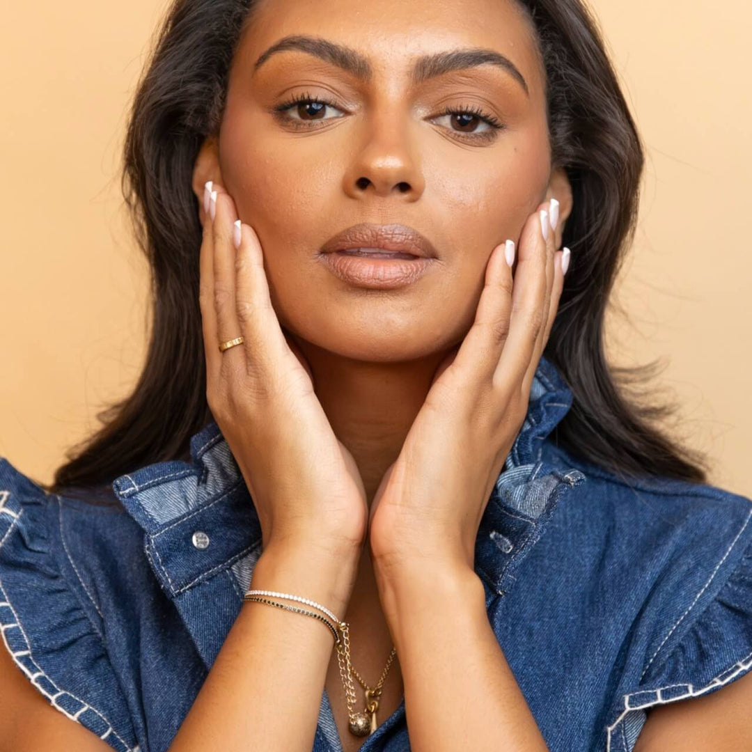 model wears 18k gold vermeil sparkly cubic zirconia tennis bracelet