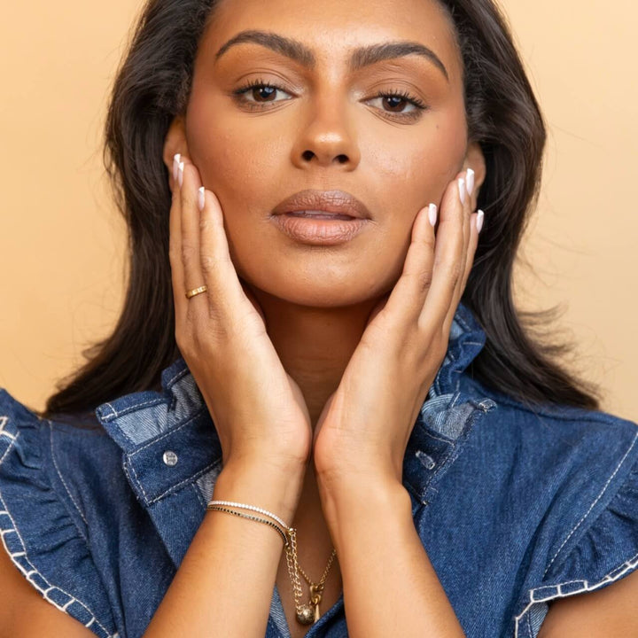 model wears 18k gold vermeil sparkly cubic zirconia tennis bracelet