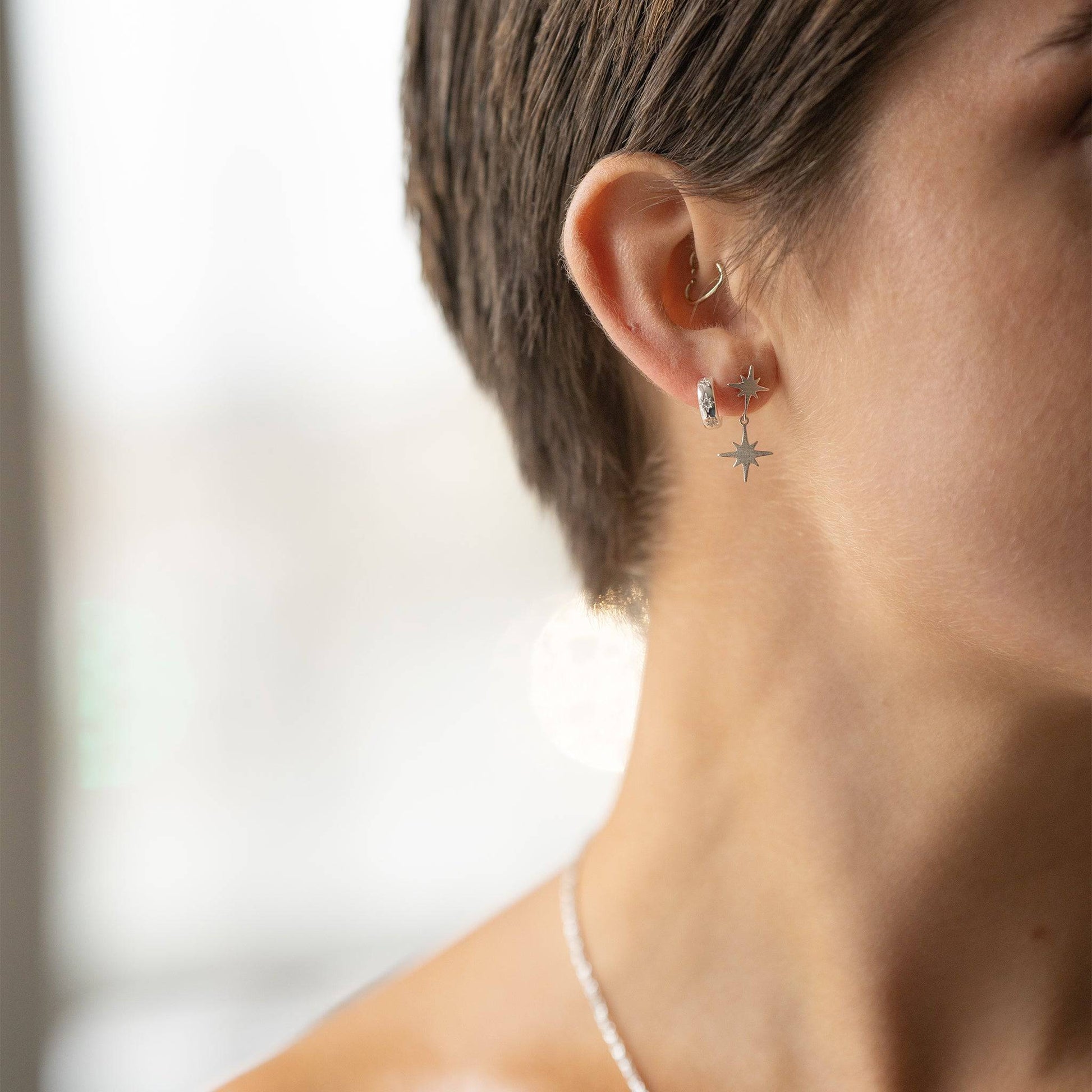 Silver Sparkly Star Huggie Earrings and silver star stud earrings