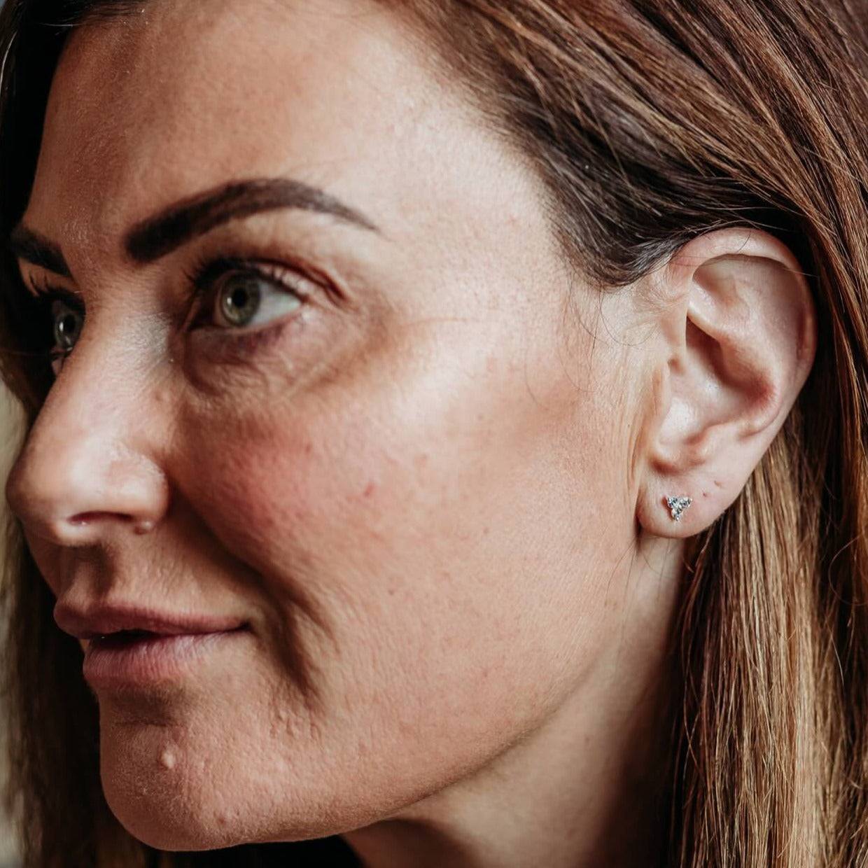 model wears Triple Sparkly Silver Mini Stud Earrings