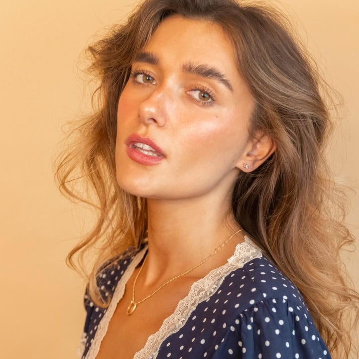 model wears cz 18k gold vermeil triple labret flat back stud earrings