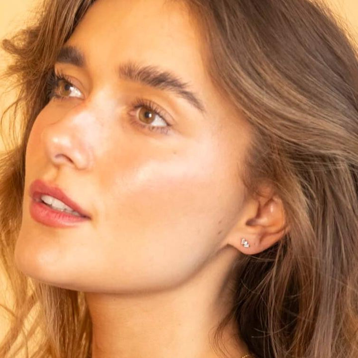 model wears cz 18k gold vermeil labret stud earring