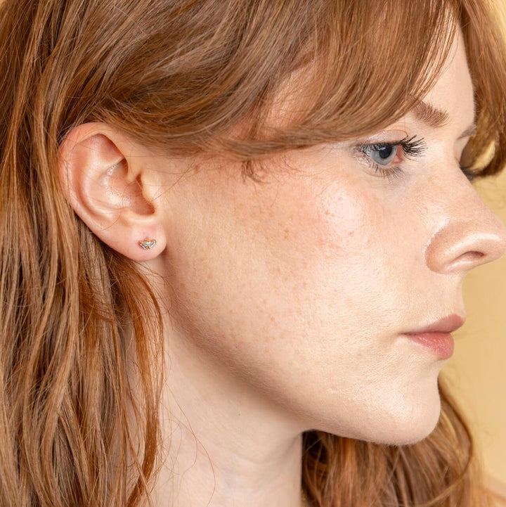 model wears triple cubic zirconia and 18k gold vermeil labret stud earring