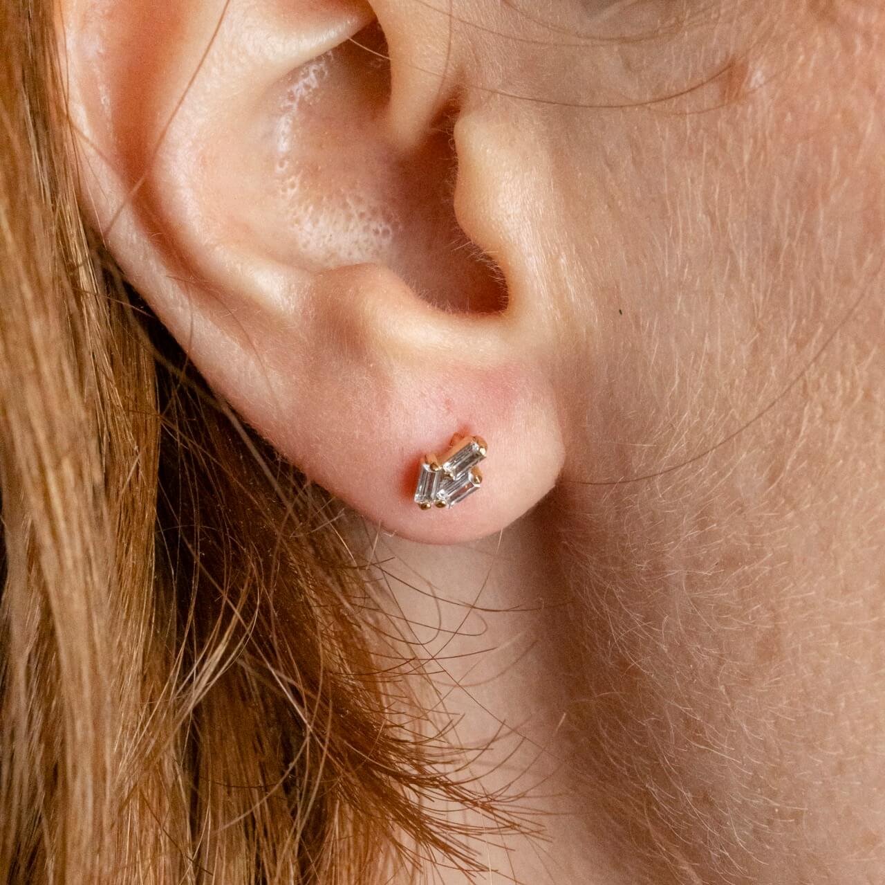 model wears triple cz 18k gold vermeil flat back labret stud earring - close up 