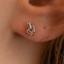 model wears triple cz 18k gold vermeil labret stud earrings 