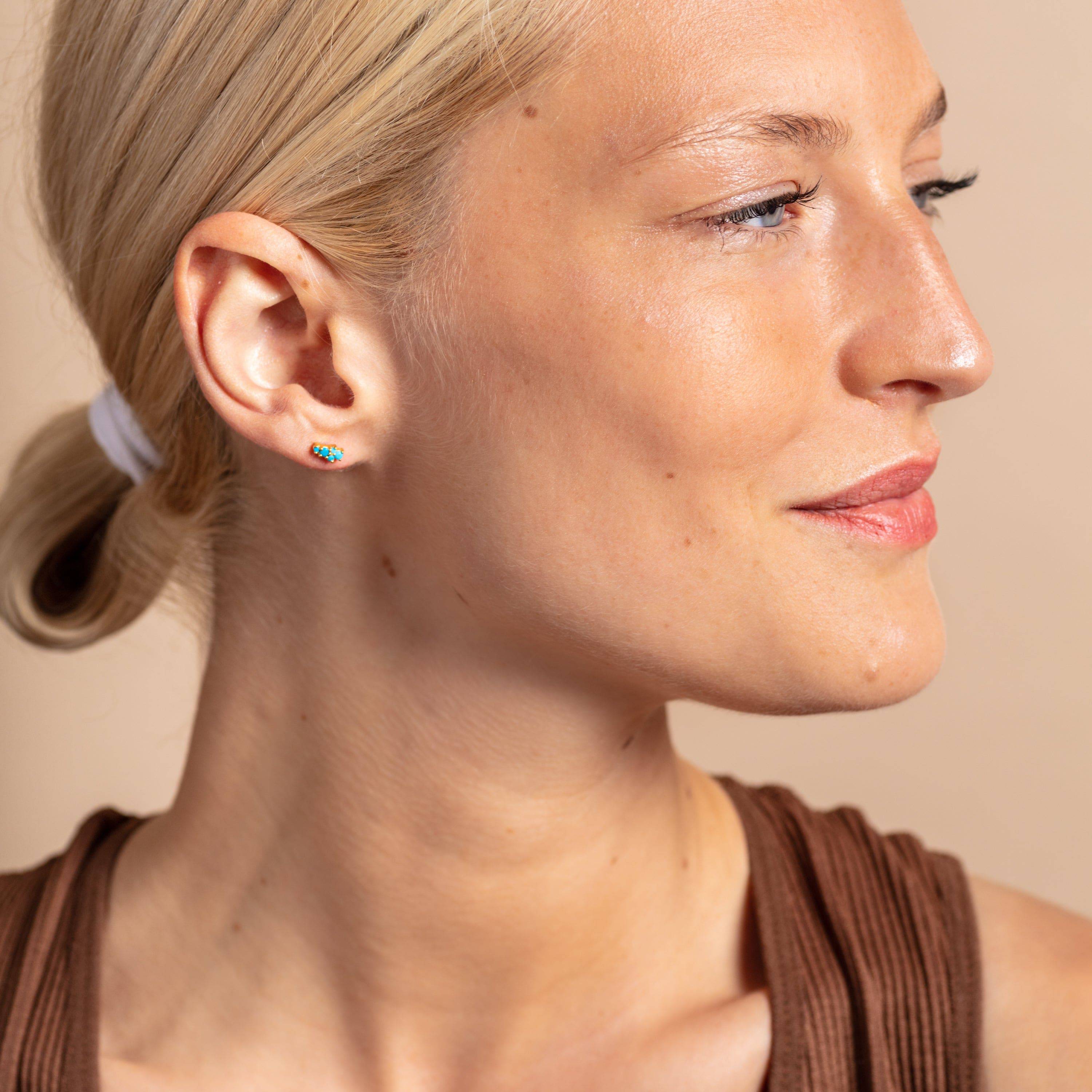 model wears Turquoise and Gold Galaxy Mini Stud Earrings