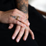 Model wears turquoise enamel stacking ring and dainty gold vermeil stacking rings 