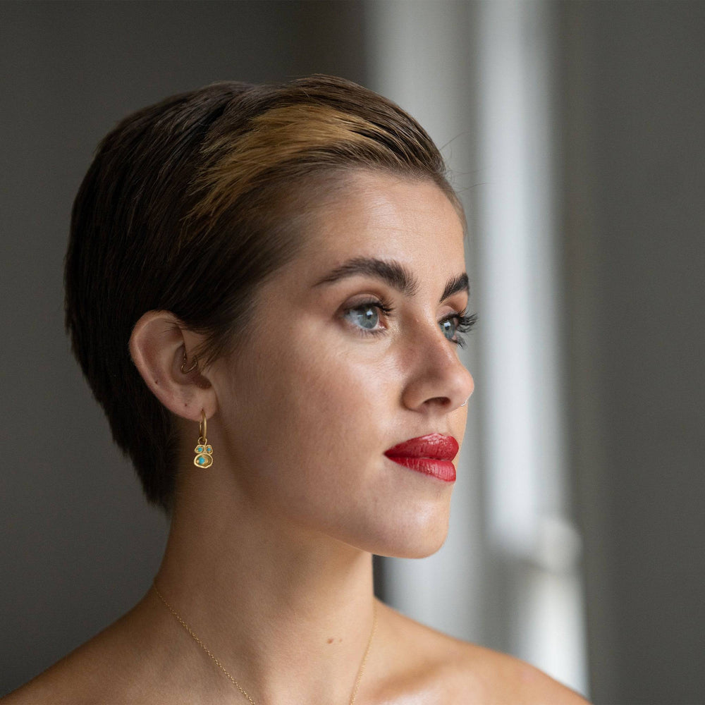 model wears Turquoise and Gold Birthstone Lichen Hoop Earrings