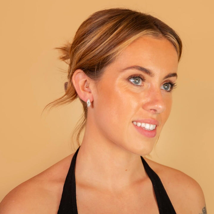 model wears White Topaz Silver Branch Hoop Earrings