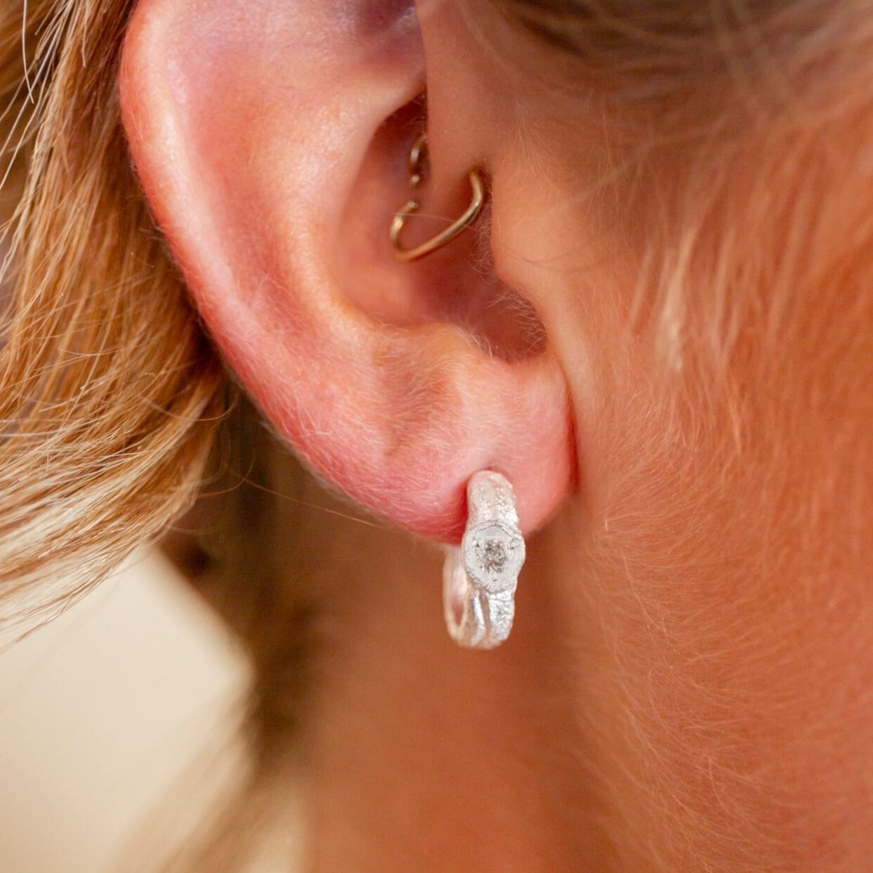 model wears White Topaz Silver Branch Hoop Earrings