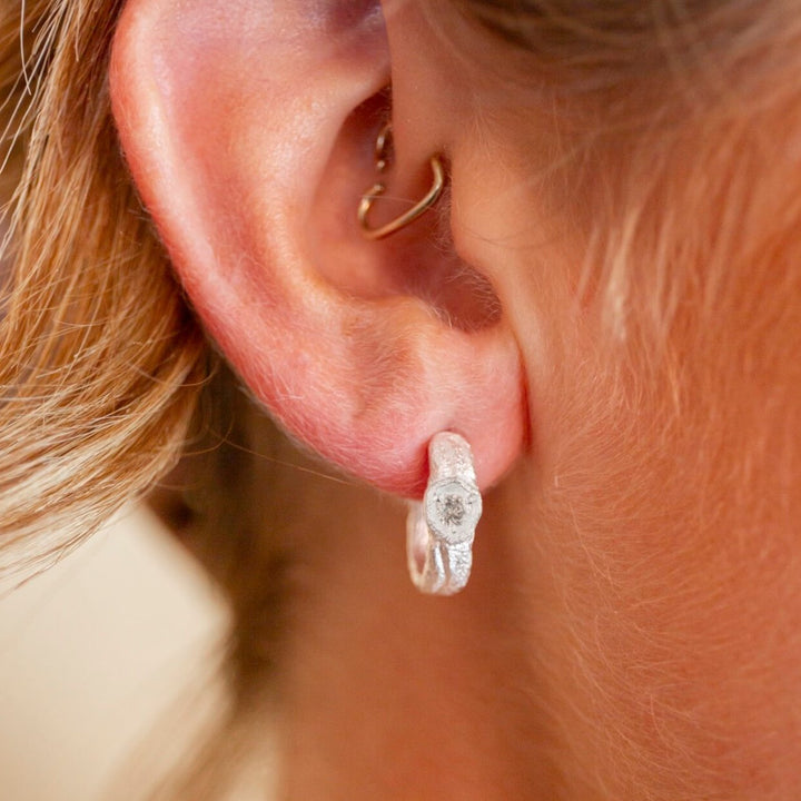 model wears White Topaz Silver Branch Hoop Earrings
