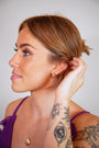 model wears White Topaz Gold Branch Hoop Earrings