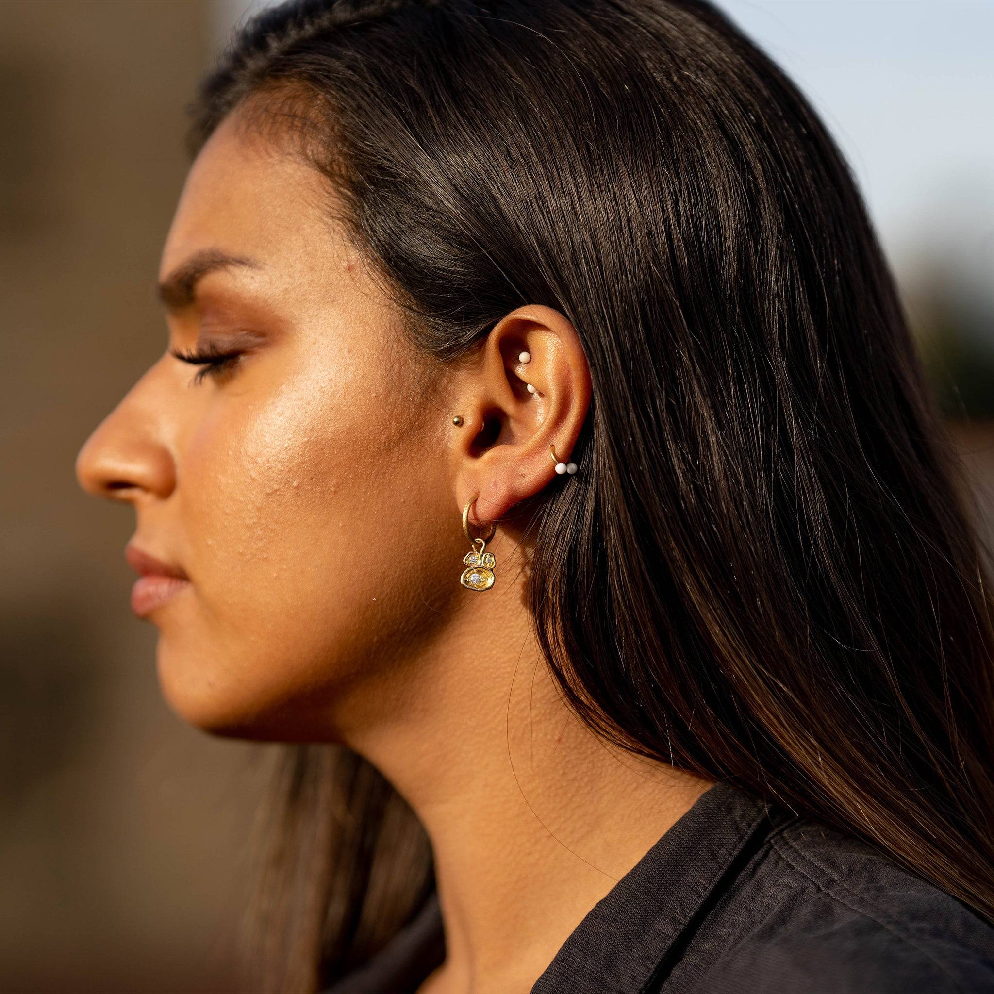 model wears White Topaz  Gold Lichen Hoop Earrings