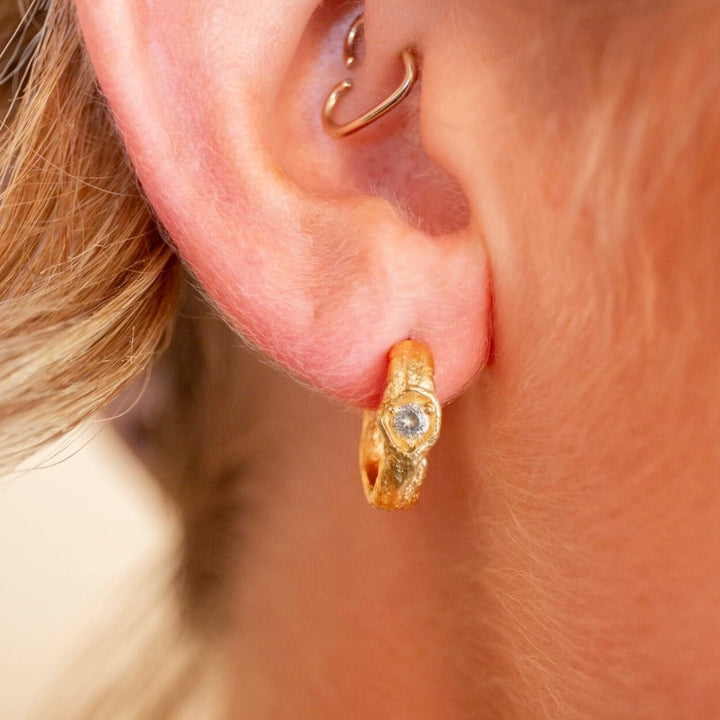 model wears White Topaz Gold Branch Hoop Earrings