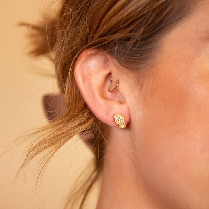 model wears White Topaz Gold Double Lichen Stud Earrings