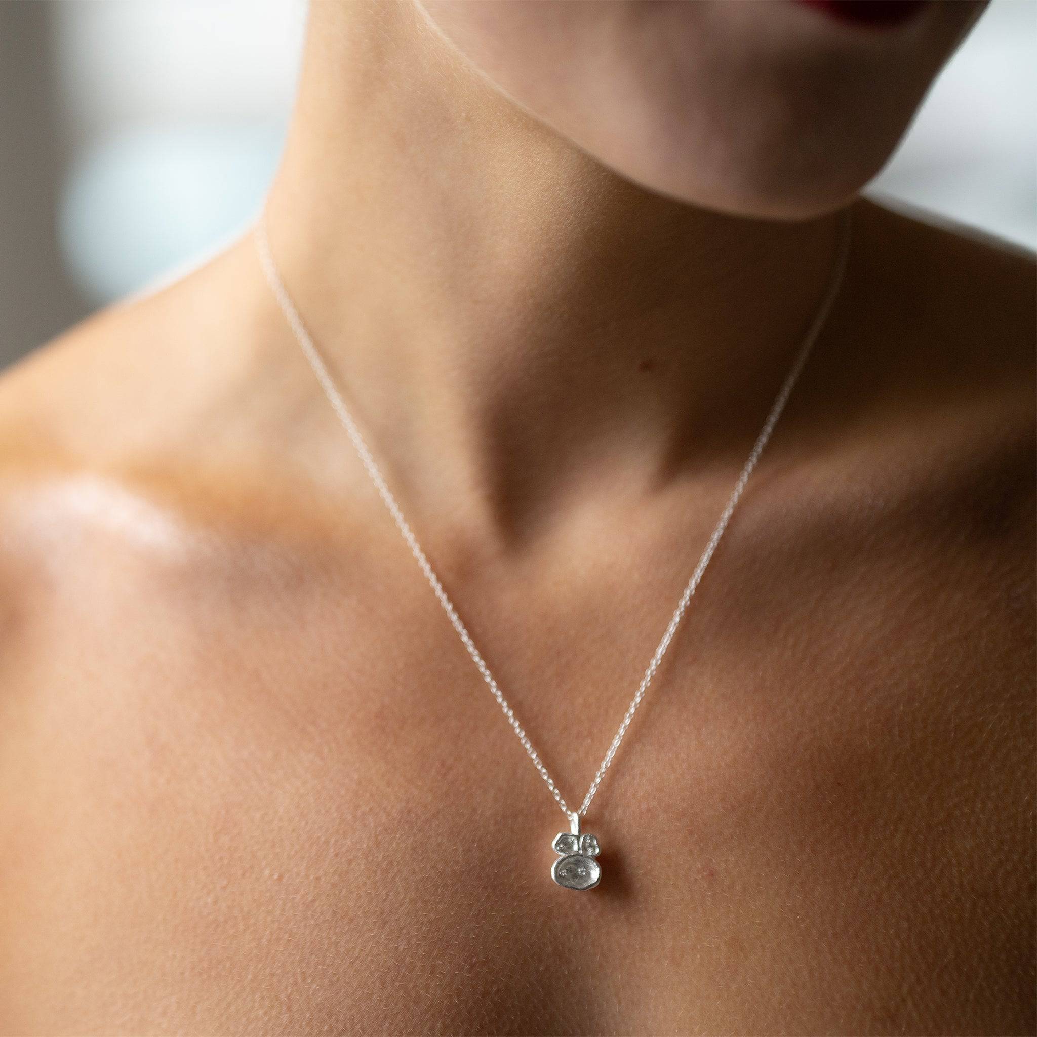 model wears White Topaz and Silver Birthstone Lichen Pendant Necklace