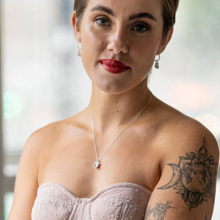 model wears White Topaz and Silver Lichen Birthstone Hoop Earrings