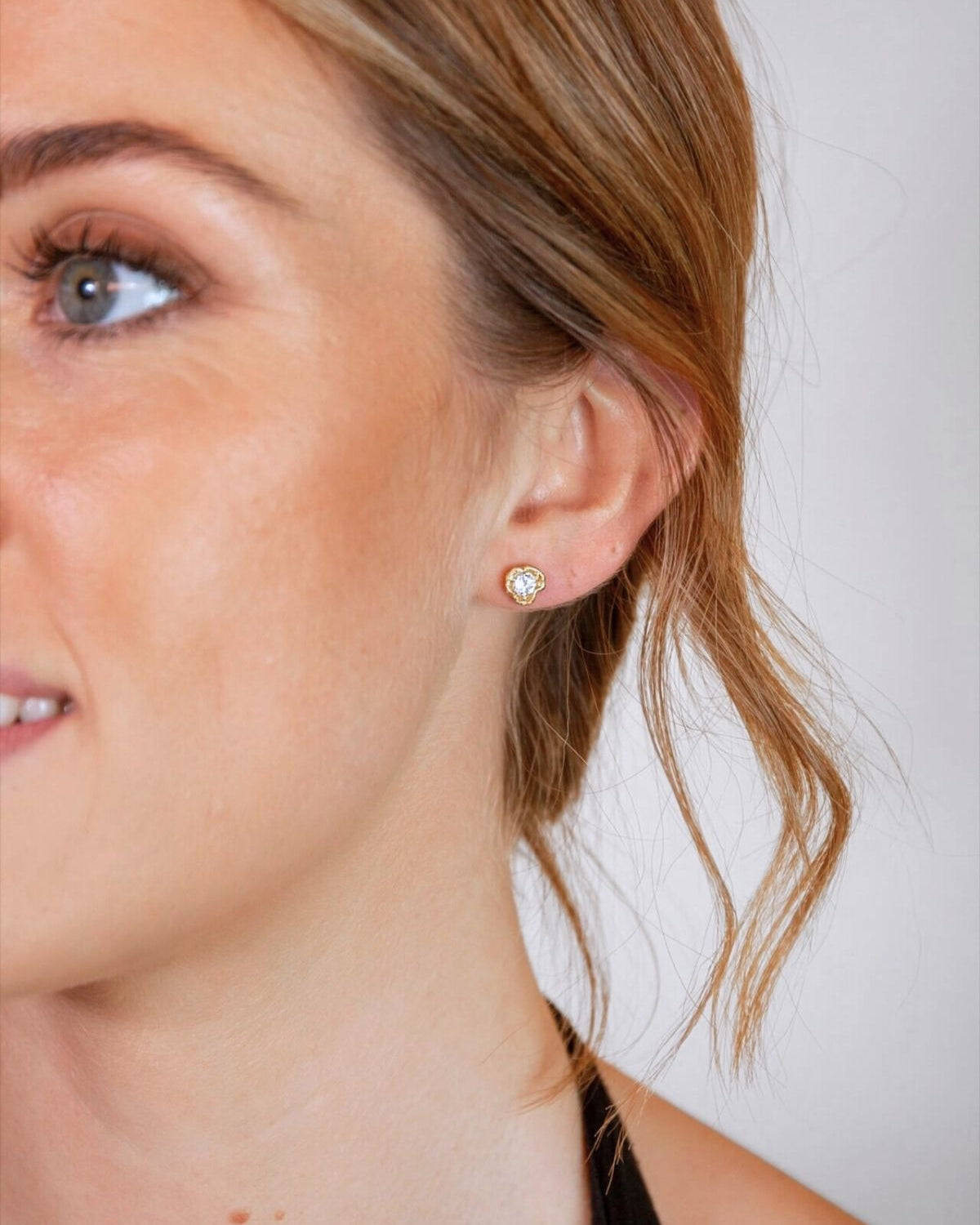 model wears White Topaz Gold Lichen Stud Earrings
