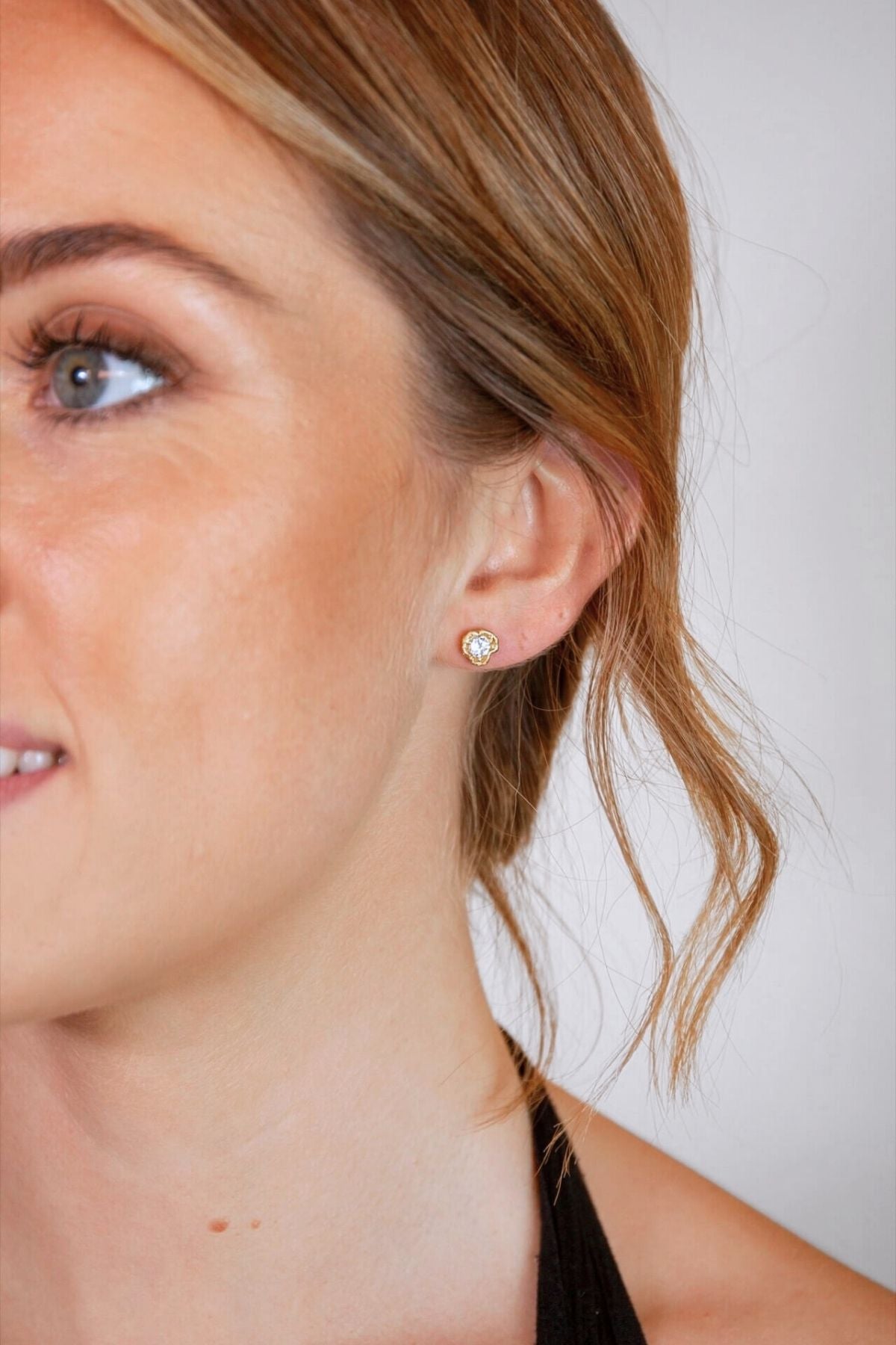 model wears White Topaz Gold Lichen Stud Earrings
