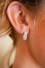 model wears White Topaz Silver Branch Hoop Earrings