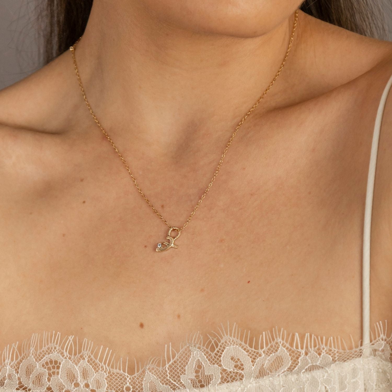 model wears Great Gold Shorthand Charm Necklace