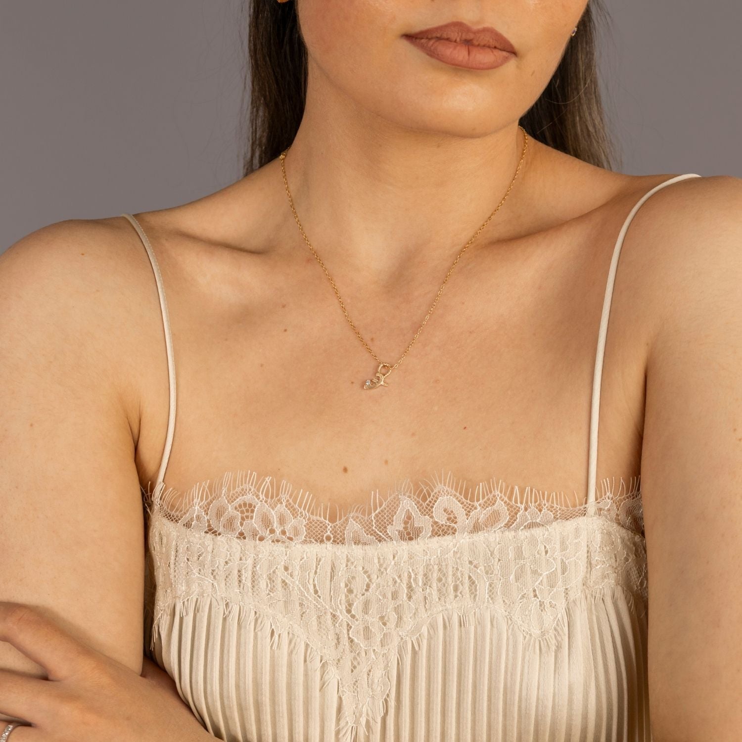 model wears Great Gold Shorthand Charm Necklace