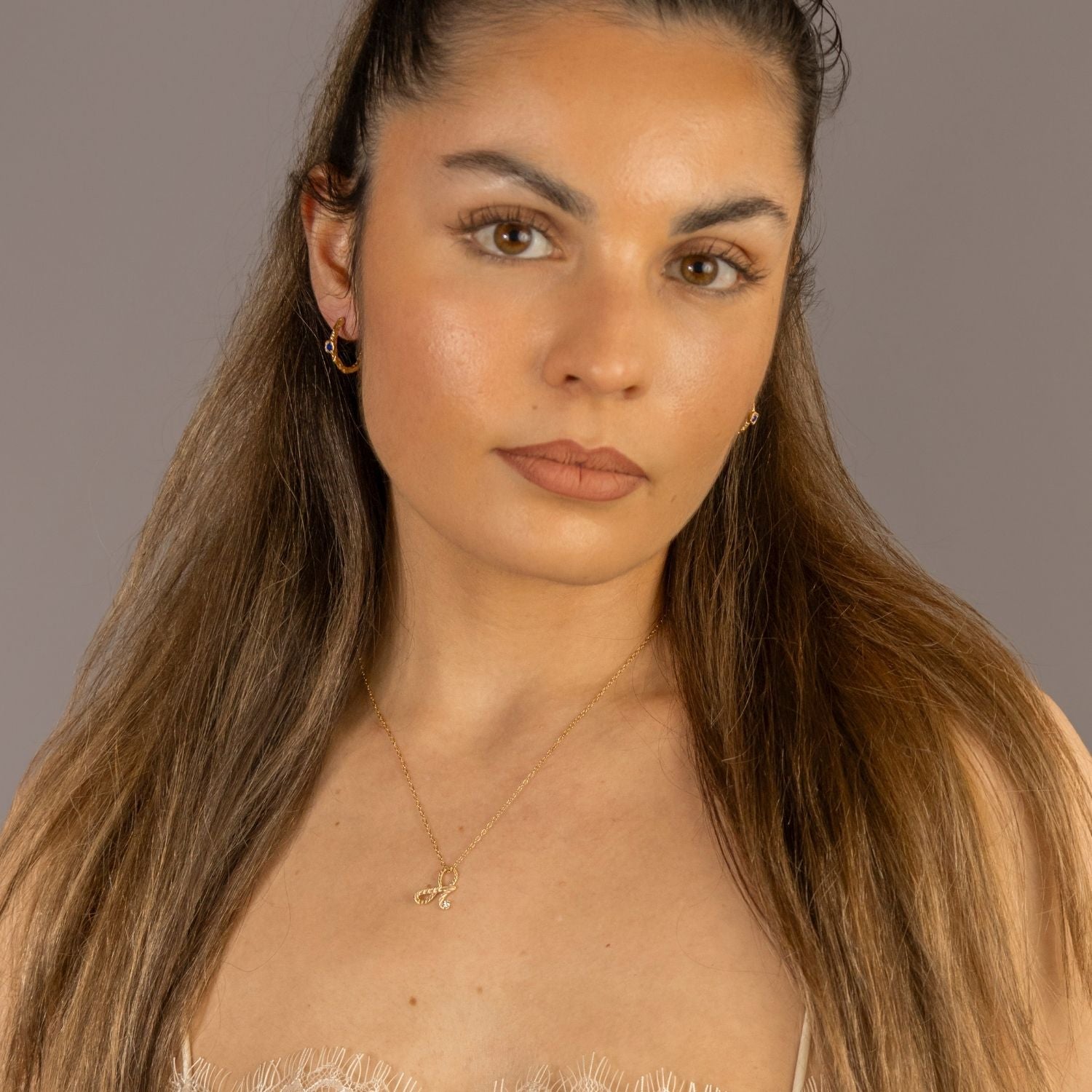 model wears Fearless Gold Shorthand Charm Necklace
