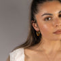 model wears Brushed Large Tapered Hoop Earrings (30mm)