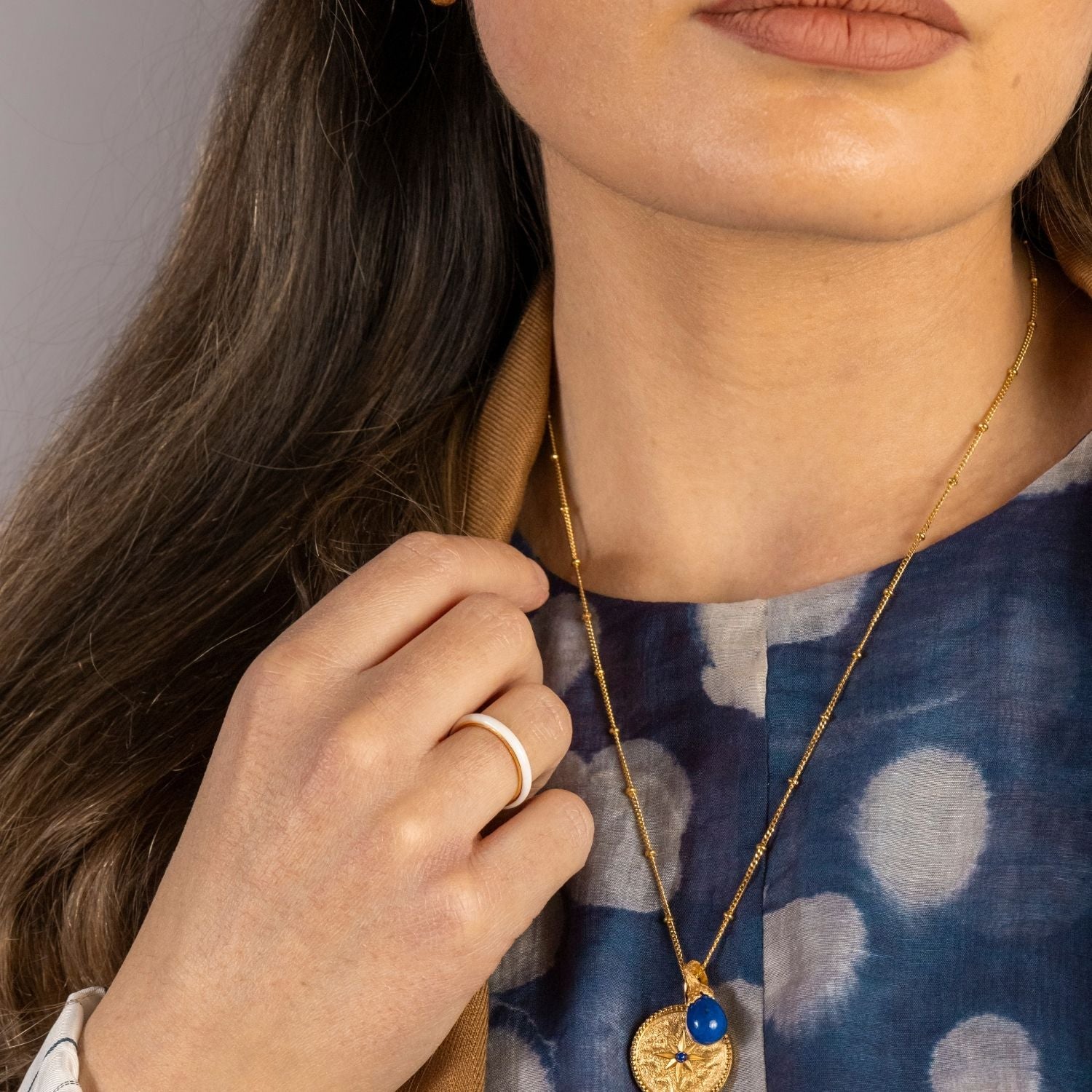 model wears White Enamel Gold Ring

