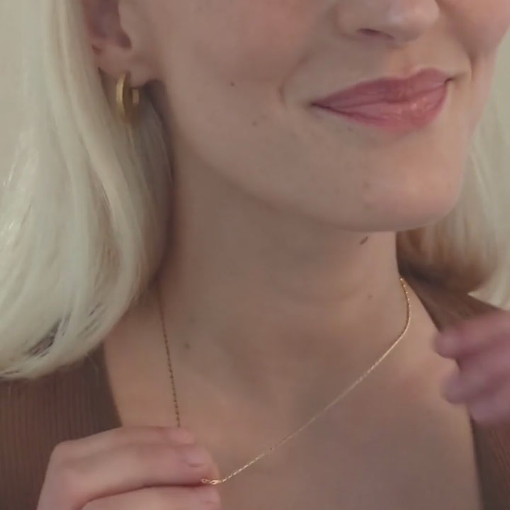 model wears 14k gold vermeil barleycorn dainty chain necklace