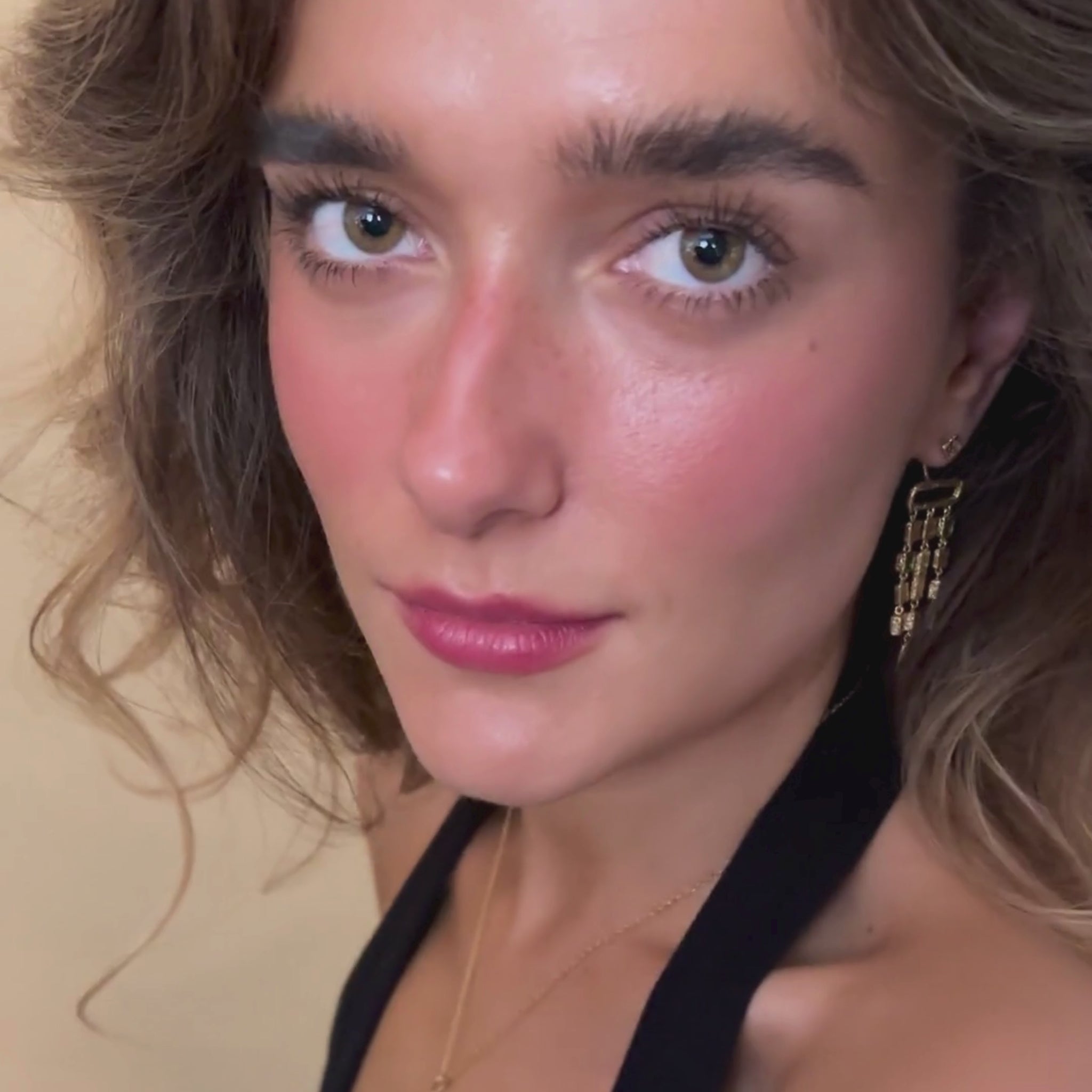 model wears Gold vermeil emerald asymetric statement ear jacket earrings