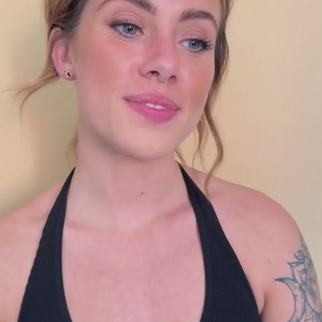 model wears 14k gold vermeil black spinel climber statement stud earrings