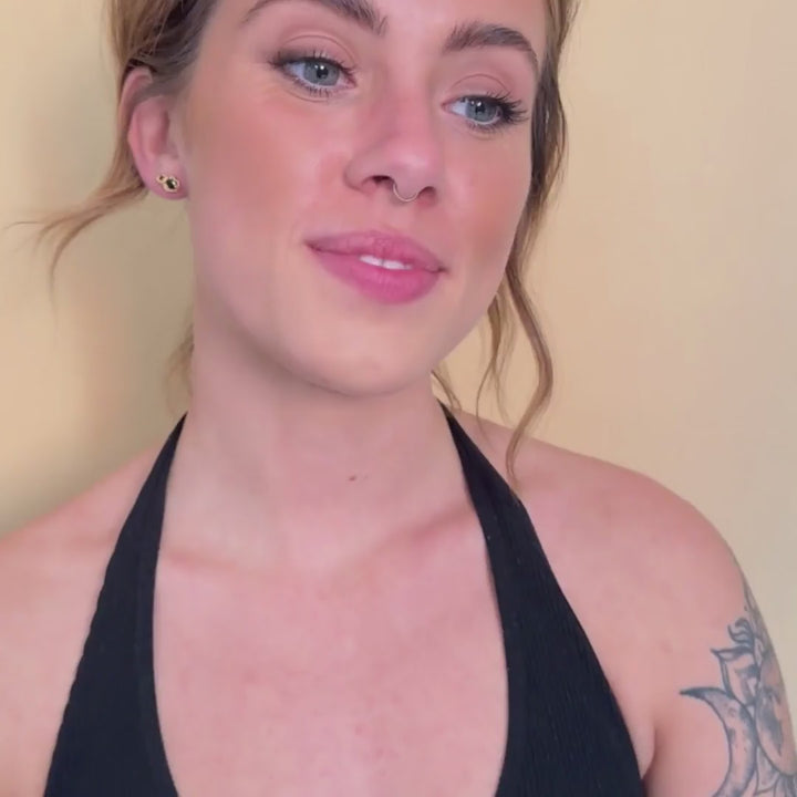 model wears 14k gold vermeil black spinel climber statement stud earrings