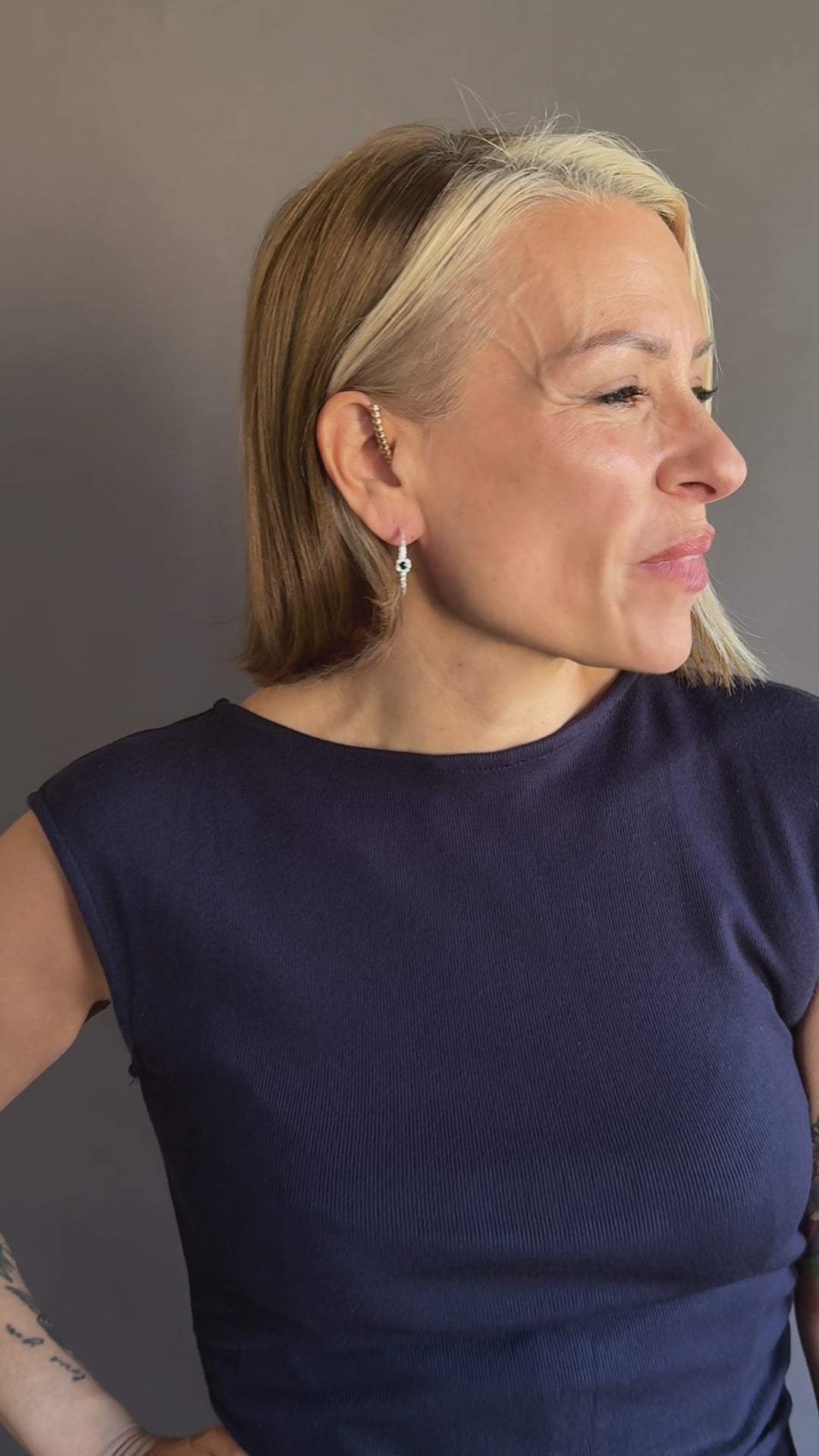 model wears large silver lapis hoop earrings
