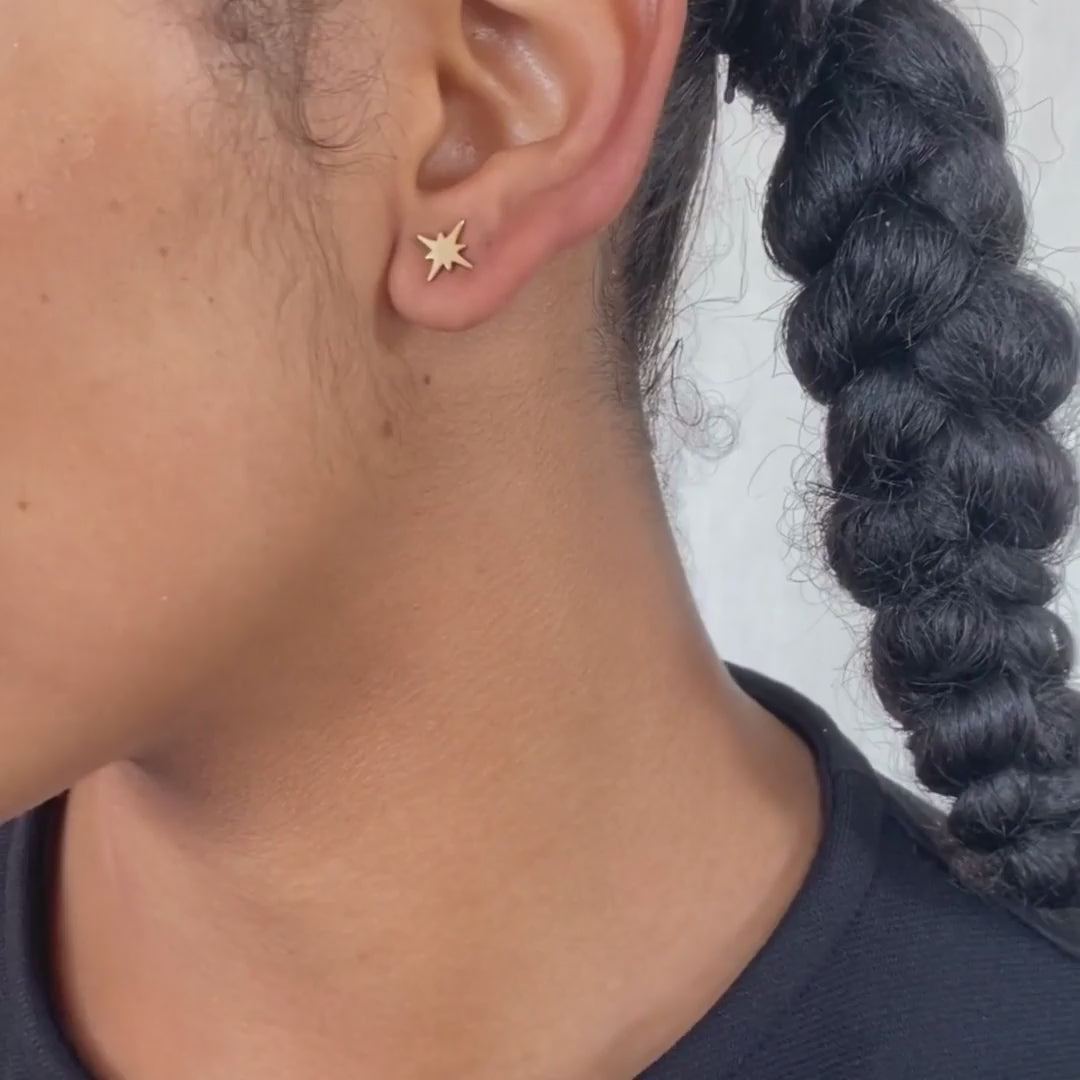 model wears 18k gold vermeil north star stud earrings