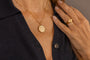 model wears C*** Gold Shorthand Coin Necklace