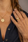 model wears C*** Gold Shorthand Coin Necklace