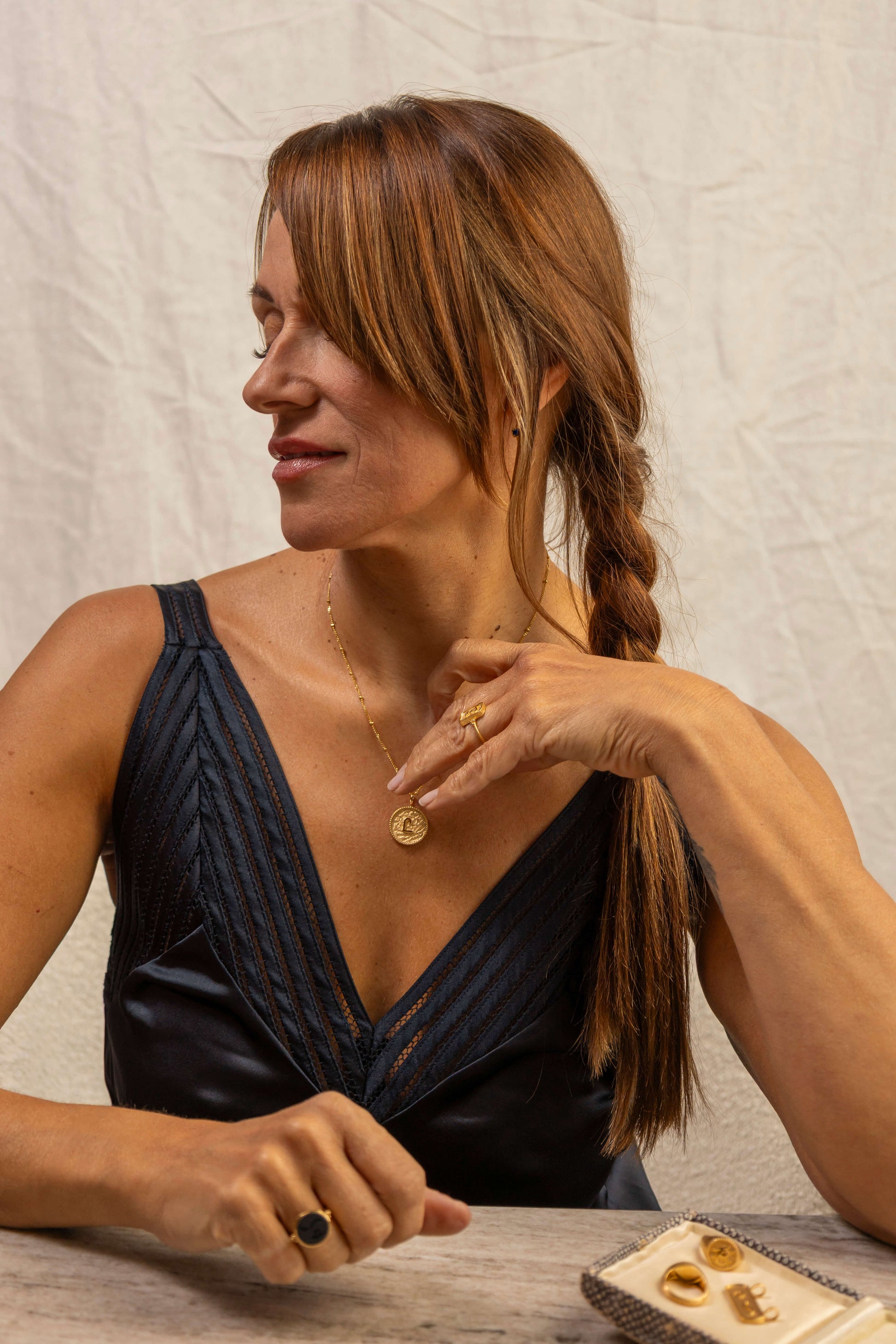 model wears C*** Gold Shorthand Coin Necklace
