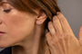 model wears C*** Silver Shorthand Stud Earring