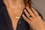model wears Difficult Woman Gold Bar Necklace