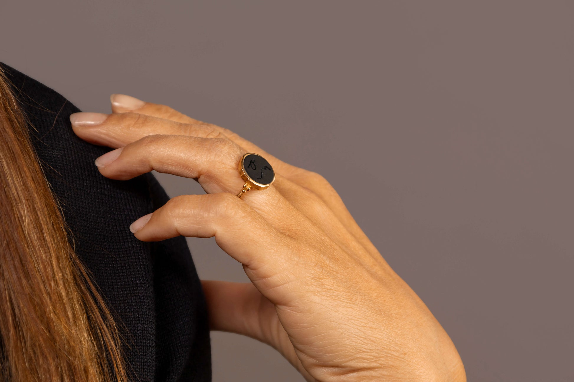 model wears Difficult Woman Onyx Gold Signet  Ring close up
