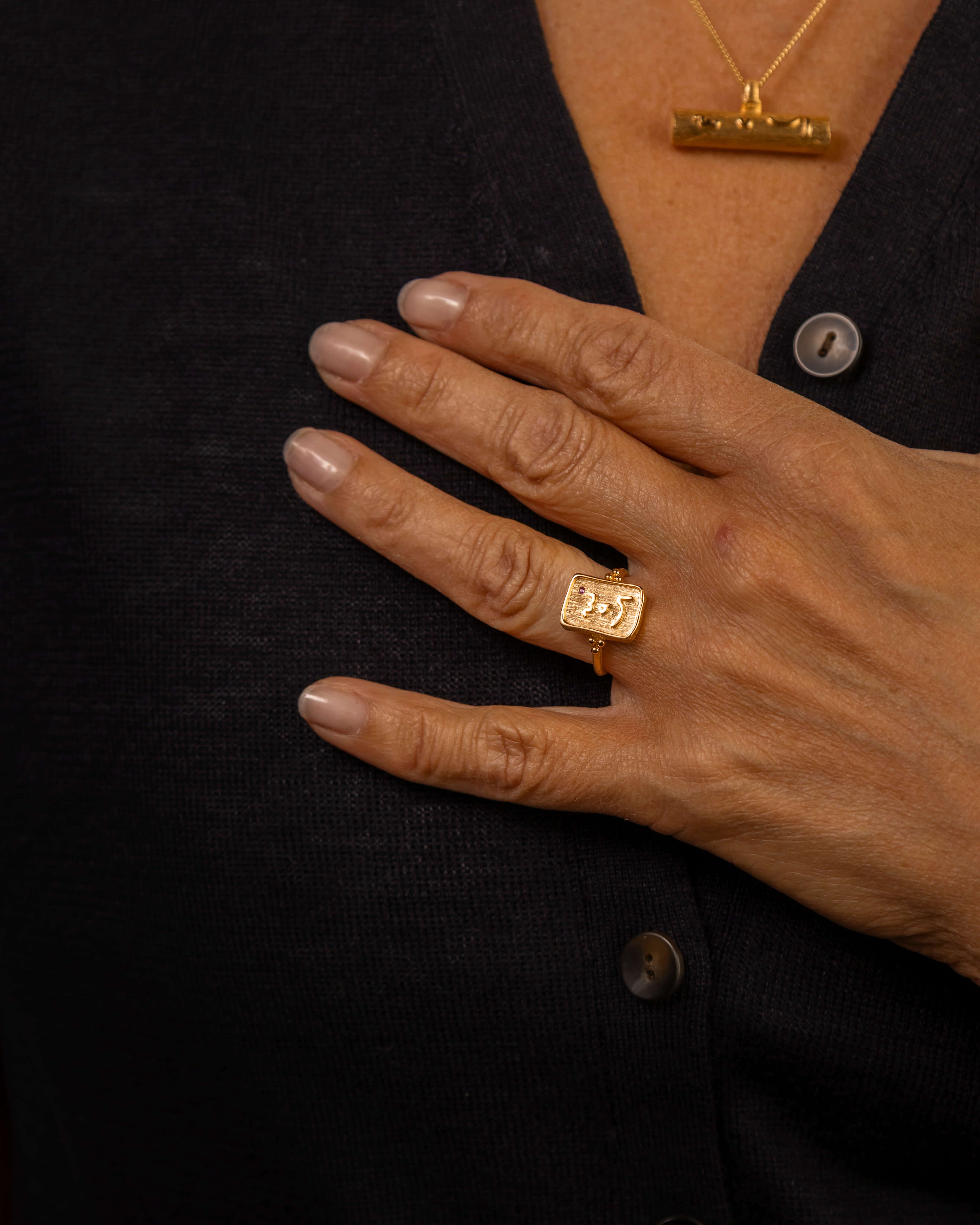 model wears Know Your Worth Gold Ring with ruby gemstone