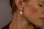 model wears Know Your Worth Silver Huggie Hoops side view 