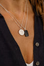 women wears C*** Silver Shorthand Coin Necklace and difficult woman onyx gemstone necklace